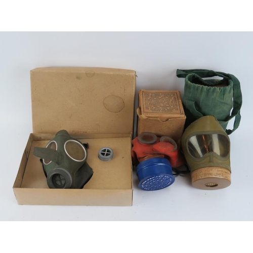 258 - Three WWII era civilian gas marks. Comprising a German, British and Japanese gas mask.(3 items)
Cond... 