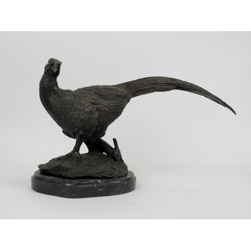 26 - A bronze cock pheasant sculpture, signed Julie Moigniez. Mounted on a black marble base. 36.5 cm len... 