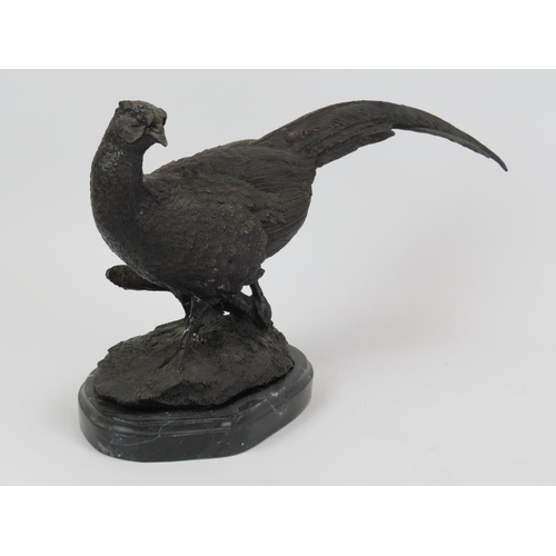 26 - A bronze cock pheasant sculpture, signed Julie Moigniez. Mounted on a black marble base. 36.5 cm len... 