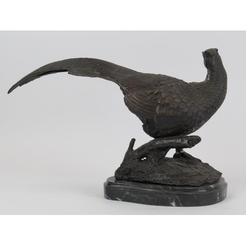 26 - A bronze cock pheasant sculpture, signed Julie Moigniez. Mounted on a black marble base. 36.5 cm len... 