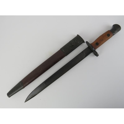 266 - A WWII British Indian army bayonet with scabbard. Ricasso struck with crown above ‘G.R.I. MkII* R.F.... 