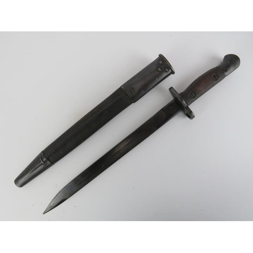 268 - A WWII British Indian army bayonet with scabbard. Ricasso struck with crown above ‘G.R.I. MkII* JU.’... 