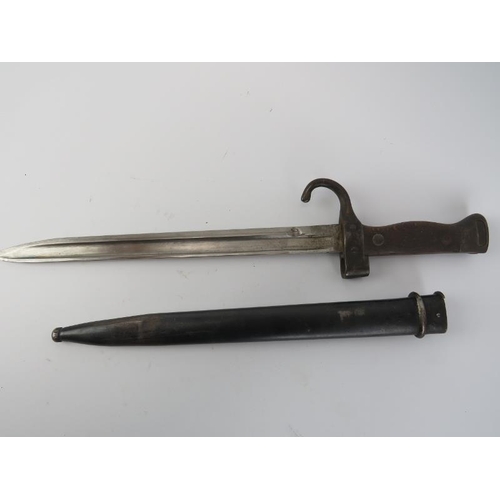 283 - A French M1892 Mannlicher Berthier bayonet with scabbard. Shorter version. 41.7 cm total length.
Con... 