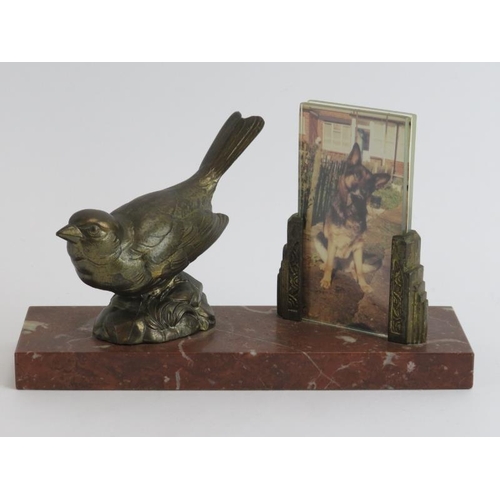 29 - A vintage Art Deco gilt metal and red marble desktop photo stand. The marble plinth mounted with as ... 