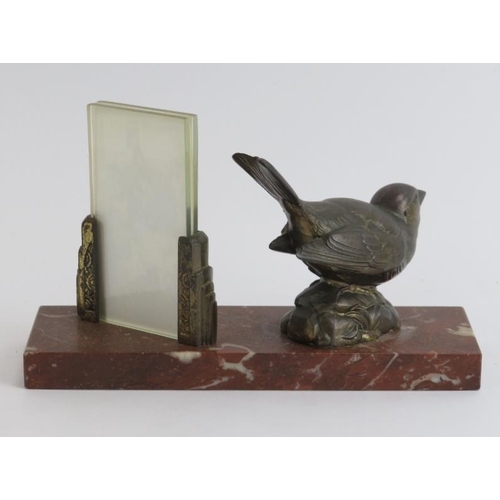 29 - A vintage Art Deco gilt metal and red marble desktop photo stand. The marble plinth mounted with as ... 