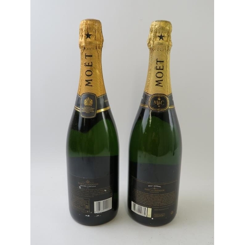 310 - 2 bottles: 1 bottle of Moet et Chandon 2002 vintage champagne, 75cl; 1 bottle of Moet et Chandon Pre... 