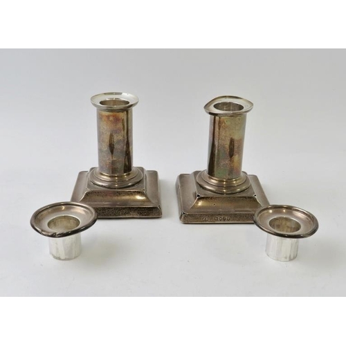 356 - A pair of short 19th century silver candlesticks with removable sconces, hallmarked for London 1881,... 