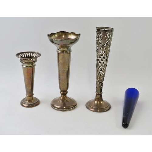 359 - Three early 20th century silver bud vases including an ornately reticulated example with blue glass ... 