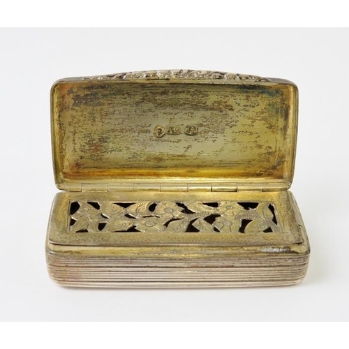 366 - A William IV silver vinaigrette of good size with gilded interior, reeded body and ornate floral gri... 