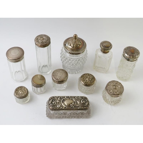 373 - 11 antique silver topped cut glass jars, various hallmarks and makers. Tallest 10.5cm. Approx gross ... 