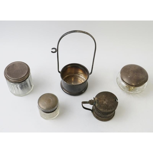 395 - A mixed lot of hallmarked silver items to include three silver topped glass jars, a mustard pot and ... 