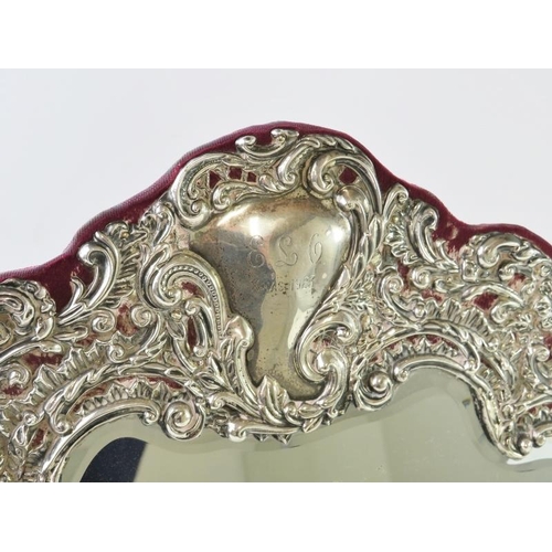 400 - A fine Edwardian silver mounted easel mirror of good proportions. The highly decorative repousse sil... 