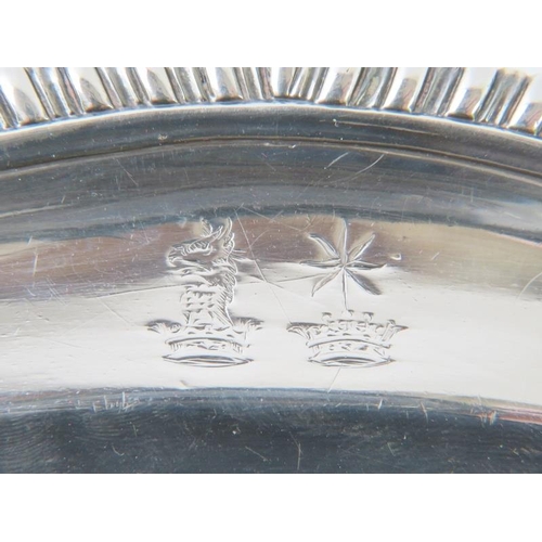 401 - A fine early George III silver platter with gadrooned rim and various engraved crests. Hallmarked fo... 