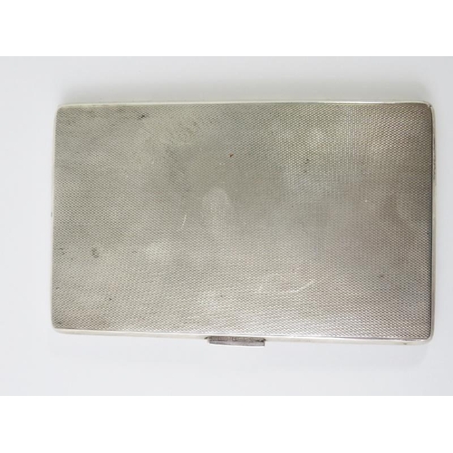 415 - A 1950s Art Deco Revival silver cigarette case with engine turned decoration and guilded interior. H... 