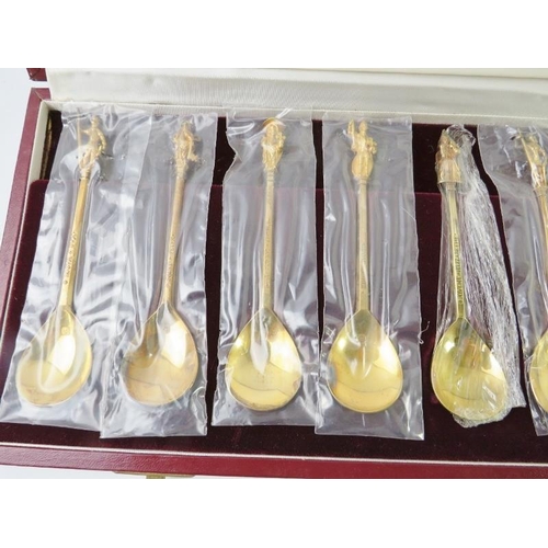 418 - A boxed set of 12 silver gilt figural Tichborne Spoons produced by The Heritage Collection. Each spo... 