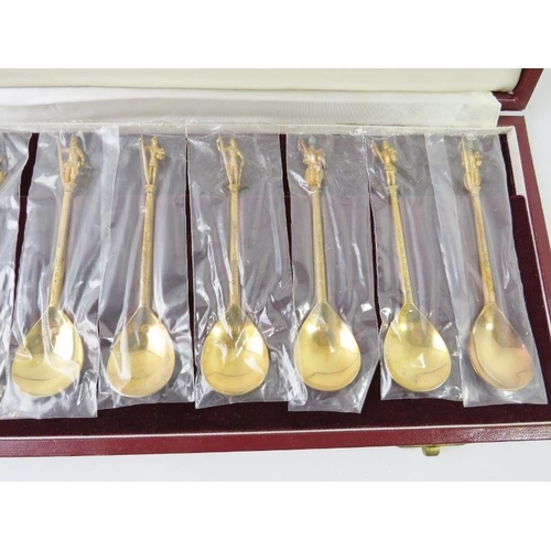 418 - A boxed set of 12 silver gilt figural Tichborne Spoons produced by The Heritage Collection. Each spo... 