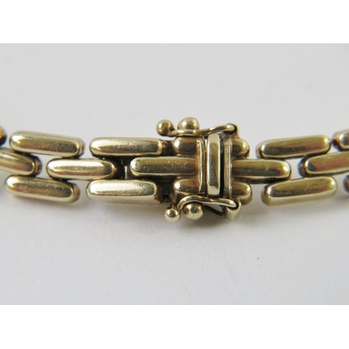 450 - A yellow metal lozenge chain link ladies bracelet, the clap marked K9. Length 20cm. Approx gross wei... 