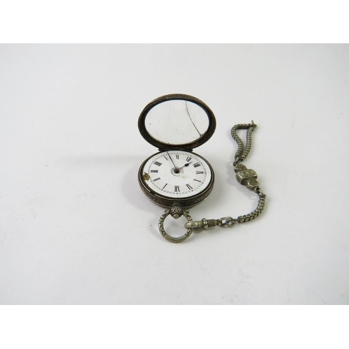 460 - A mixed lot to include a white metal pocket watch, watch chain, various medallions/coins, watch part... 