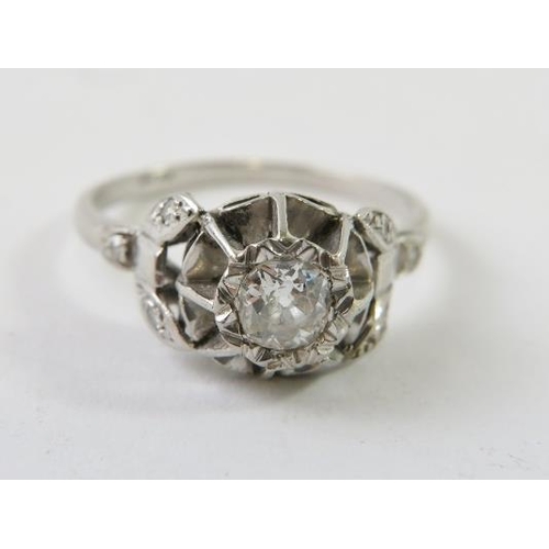 466 - A diamond single stone ring, the round old cut diamond in a raised illusion setting with single cut/... 