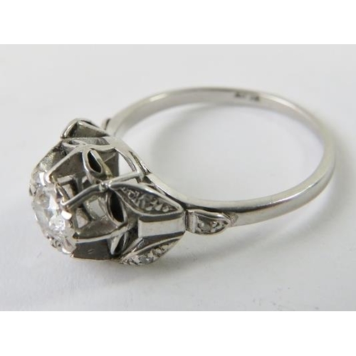 466 - A diamond single stone ring, the round old cut diamond in a raised illusion setting with single cut/... 