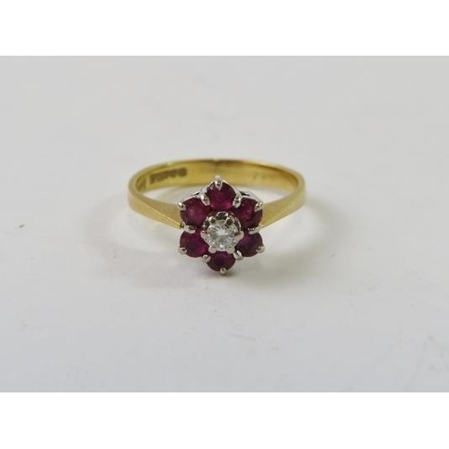 468 - An 18ct gold, diamond and ruby cluster ring.
Condition report:  2.8gms approx, diamond estimated 0.1... 