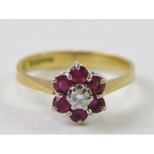 468 - An 18ct gold, diamond and ruby cluster ring.
Condition report:  2.8gms approx, diamond estimated 0.1... 