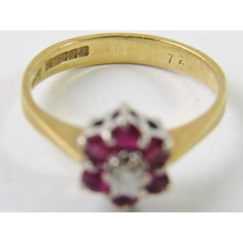 468 - An 18ct gold, diamond and ruby cluster ring.
Condition report:  2.8gms approx, diamond estimated 0.1... 