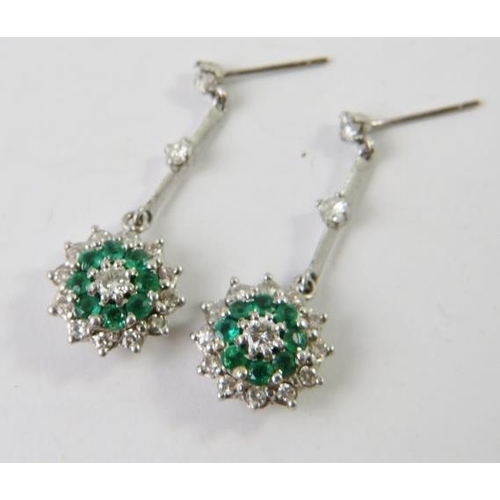 473 - A pair of emerald and diamond drop cluster earrings, the round brilliant diamond and emerald drop cl... 