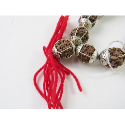 477 - A long strand of ethnic beads with white metal mounts.
Condition report: 144gms gross approx