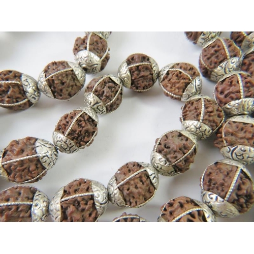 477 - A long strand of ethnic beads with white metal mounts.
Condition report: 144gms gross approx