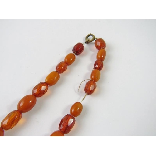 492 - A graduated amber bead and faceted bead necklace, ranging from 11mm to 19.70mm, 44gms approx 
Condit... 