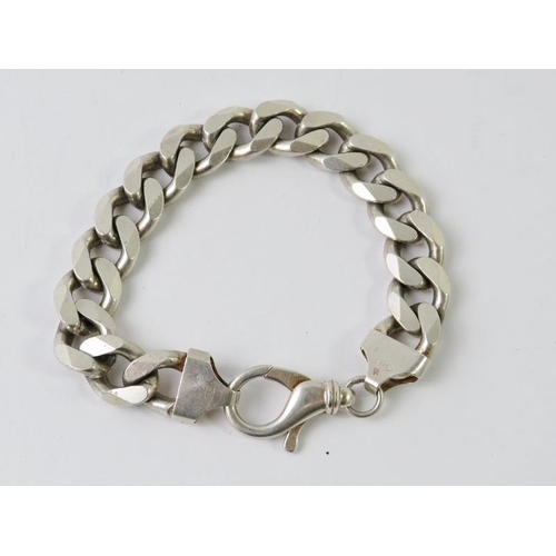 495 - A heavy silver retro flat curb link bracelet, marked 925 and bearing full import hallmarks. Overall ... 