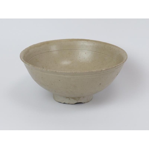 54 - A Chinese pale celadon glazed stoneware bowl. Song dynasty style, probably 19th/early 20th century. ... 