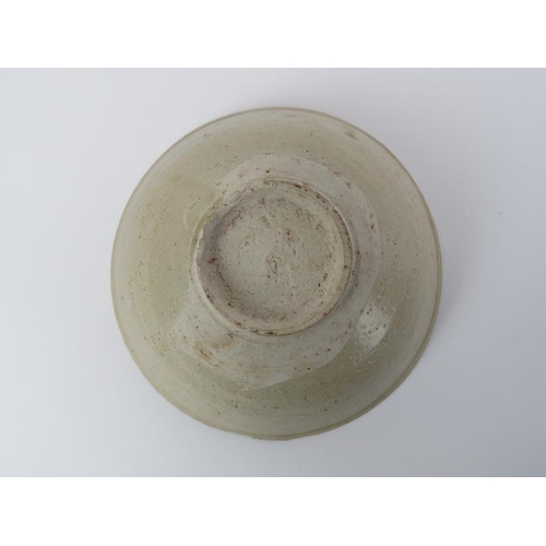 54 - A Chinese pale celadon glazed stoneware bowl. Song dynasty style, probably 19th/early 20th century. ... 