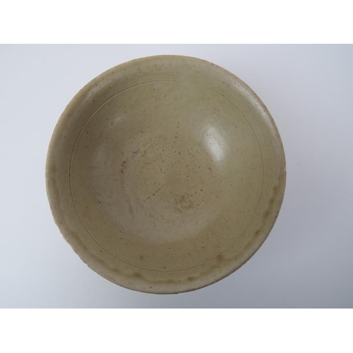 54 - A Chinese pale celadon glazed stoneware bowl. Song dynasty style, probably 19th/early 20th century. ... 