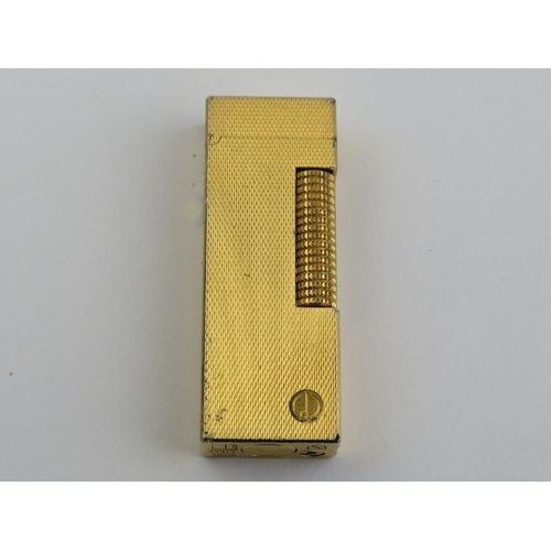 60 - A vintage Dunhill Rollagas rolled gold plated lighter. With presentation box and paperwork. 6.4 cm l... 