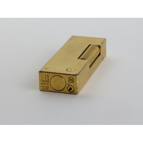 60 - A vintage Dunhill Rollagas rolled gold plated lighter. With presentation box and paperwork. 6.4 cm l... 