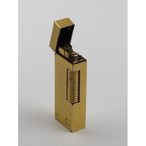 60 - A vintage Dunhill Rollagas rolled gold plated lighter. With presentation box and paperwork. 6.4 cm l... 