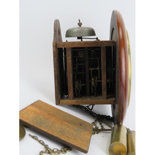 67 - A small mahogany Postman's alarm wall clock, 19th century. With twin weights and striking bell. 21.3... 