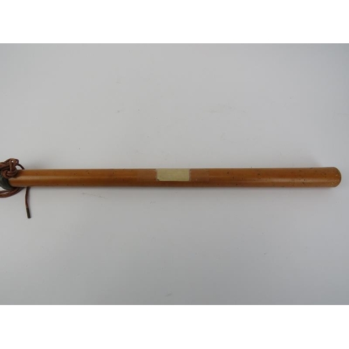 71 - A vintage rosewood conductors button and a police officer’s truncheon/baton, 19th/early 20th century... 