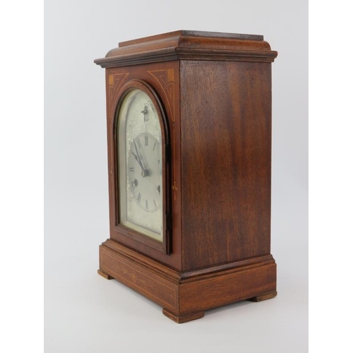 73 - A mahogany inlaid musical mantel clock, early 20th century. 35.5 cm height.
Condition report: Some a... 