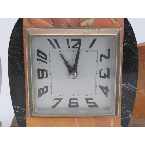 83 - A French Art Deco marble 8 day mantle clock garniture. The clock mounted with a bronzed metal stag. ... 