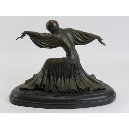 89 - An Art Deco style bronze female dancing figure wearing an Egyptian revival dress, late 20th century.... 