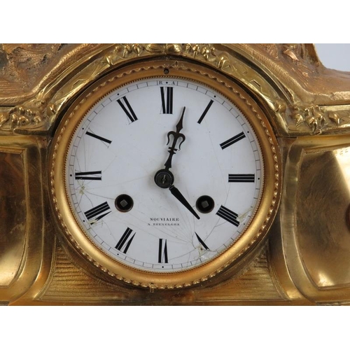 9 - A Belgian gilt bronze French style mantel clock, 19th century. Surmounted with a cavalier on horseba... 