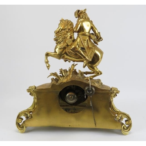 9 - A Belgian gilt bronze French style mantel clock, 19th century. Surmounted with a cavalier on horseba... 