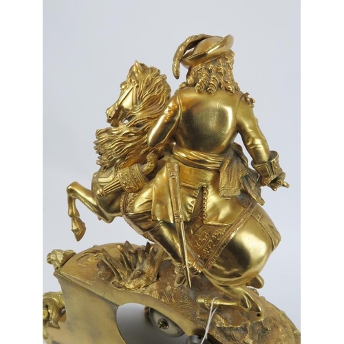 9 - A Belgian gilt bronze French style mantel clock, 19th century. Surmounted with a cavalier on horseba... 