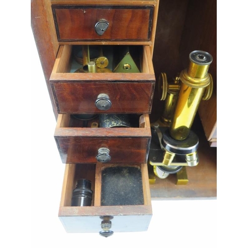 92 - A large Victorian scientific microscope cabinet with compartmented graduated draw interior together ... 