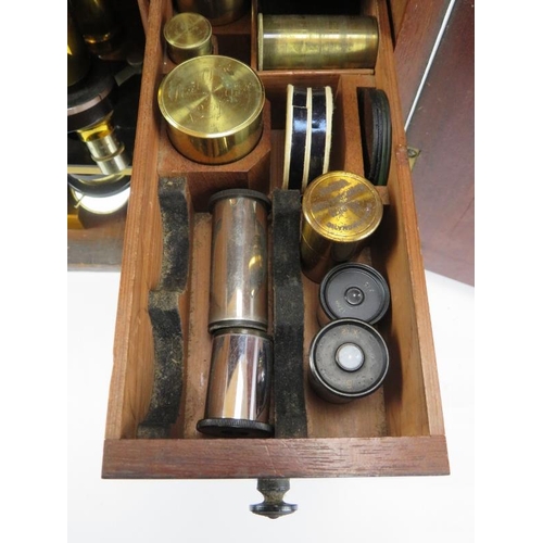 92 - A large Victorian scientific microscope cabinet with compartmented graduated draw interior together ... 