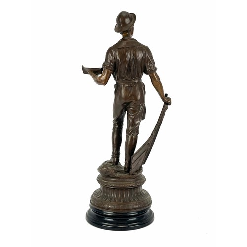 170 - A large bronzed metal statue of a young sailor holding a boat, 20th century. 50.5 cm height. 
Condit... 