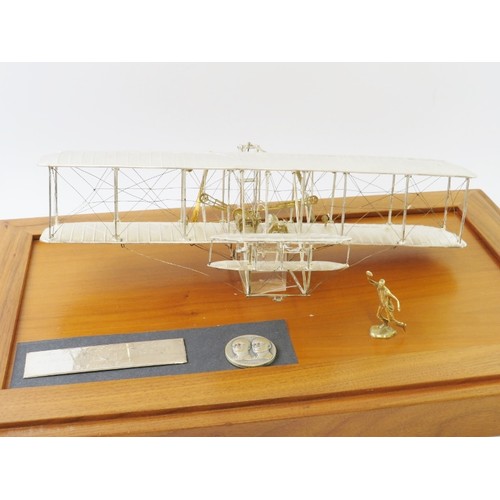 351 - A limited edition sterling silver replica model of the Wright Brothers aeroplane 'Flyer' produced by... 